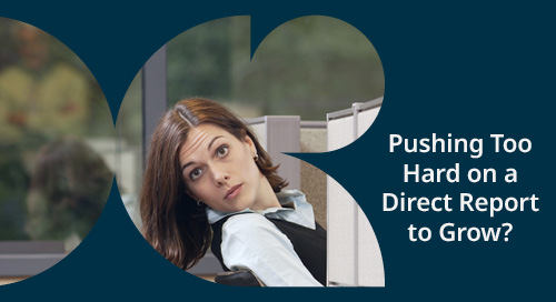 Image of a concerned woman looking over a cubicle with the text 'Pushing Too Hard on a Direct Report to Grow?'