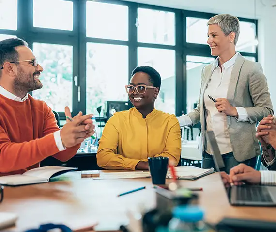 smiling coworkers in a meeting