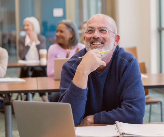 smiling man at desk