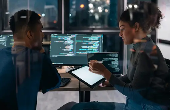 man and women in tech environment