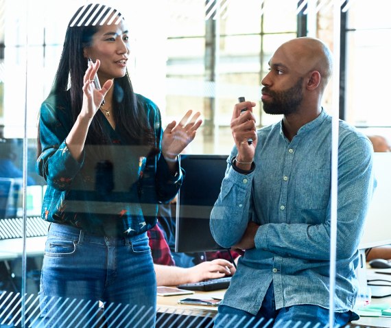 man and women in discussion at work