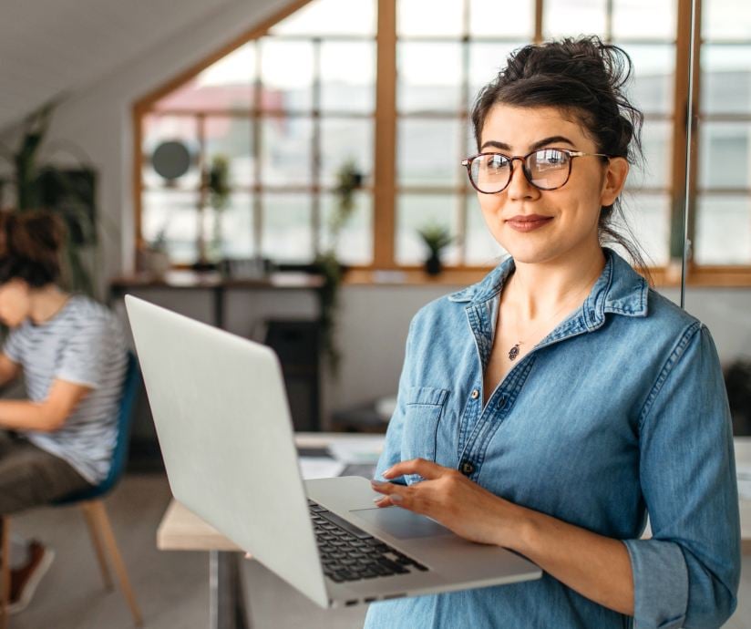 women holding laptop