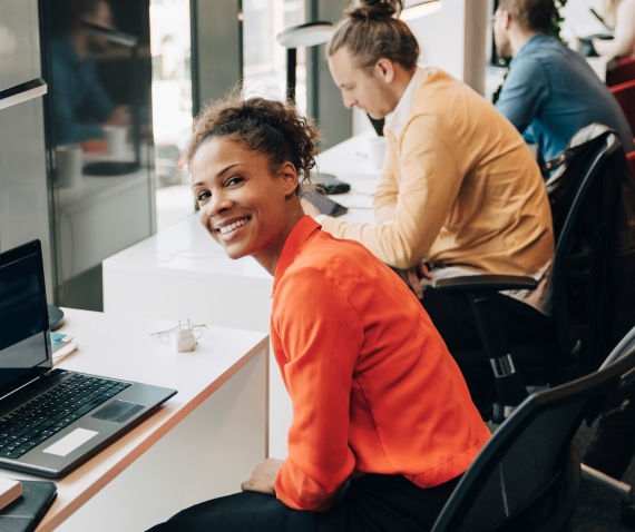 smiling women at desk