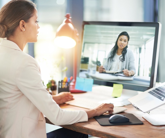 A woman on a video call with another woman