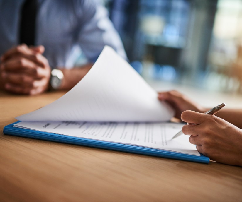 person writing on a desk