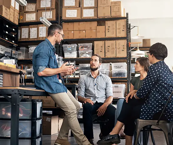 people meeting in a warehouse