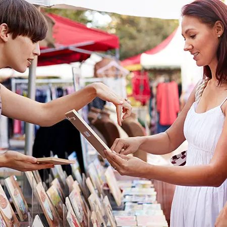 women shopping at outdoor booth