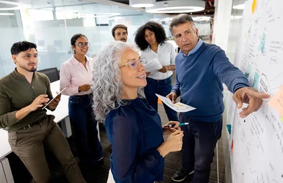 team meeting around white board