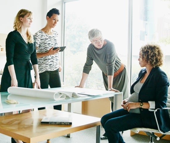 Four women in office setting