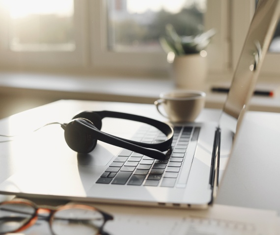 computer and headset on desk